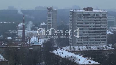 City time lapse at the evening. Factory chimney with smoke. Moscow, aerial view.