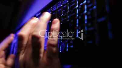 Man hands typing on the blue keyboard. Time lapse.