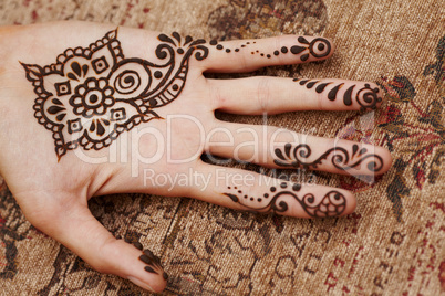 henna art on woman's hand