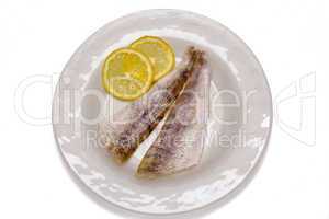 Two raw fish filets in white plate