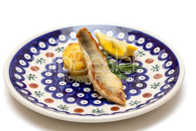 Appetizer of Perch Filet with Fried Potatoes, Lemon and Dill