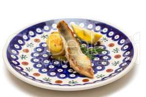 Appetizer of Perch Filet with Fried Potatoes, Lemon and Dill