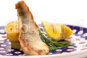 Appetizer of Perch Filet with Fried Potatoes, Lemon and Dill