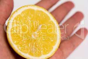 Lemon Half in a Hand