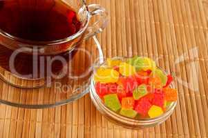 Cup of tea with candied fruits