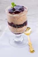 vanilla pudding with cherry and biscuit