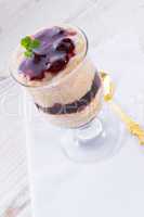 vanilla pudding with cherry and biscuit