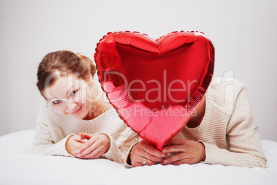 The girl and the guy with balloons in the form of heart