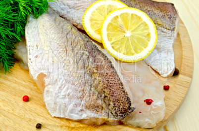 Fillet of codfish on a round board