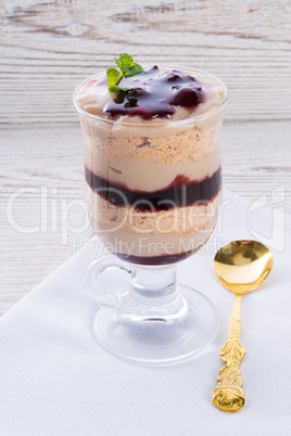 vanilla pudding with cherry and biscuit