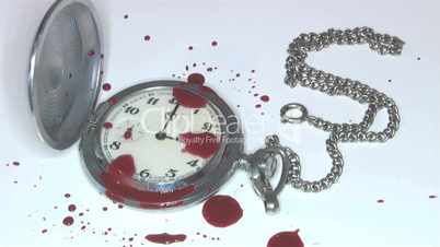 a drop of blood on the clock witnesses a crime,