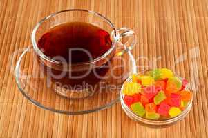 Cup of tea with candied fruits