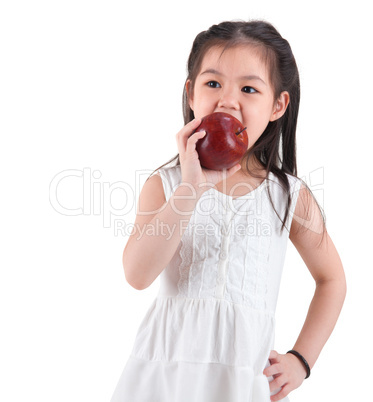 Asian child eating an apple