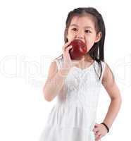 Asian child eating an apple