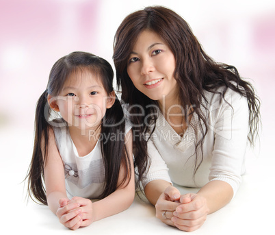 Portrait of a joyful mother and her daughter