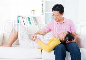 Asian pregnant couple having conversation