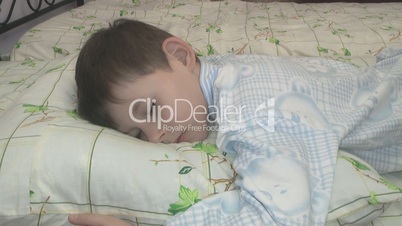 boy sleeps in the nursery.