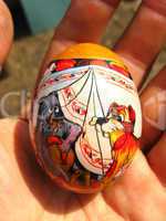 Easter egg with drawing in hand