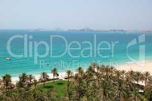 Beach with a view on Jumeirah Palm man-made island, Dubai, UAE