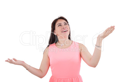 Shocked and excited woman looking up, isolated on white