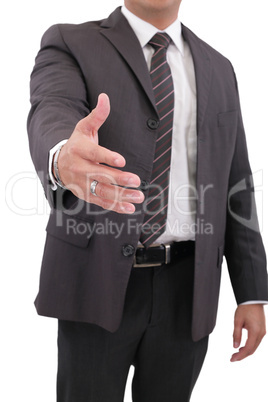 Business man with hand extended to handshake - isolated over whi