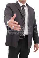 Business man with hand extended to handshake - isolated over whi