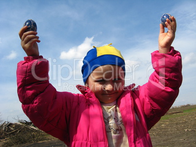 girl with Easter eggs in hands
