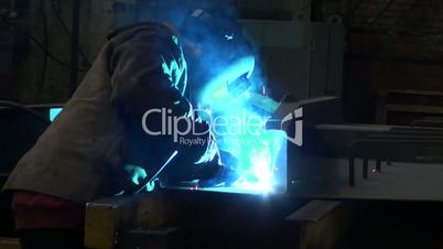 man working with metal at the plant