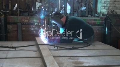 welder working hard at the plant