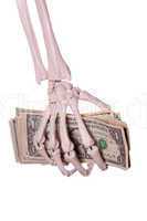 skeleton fingers holding dollars