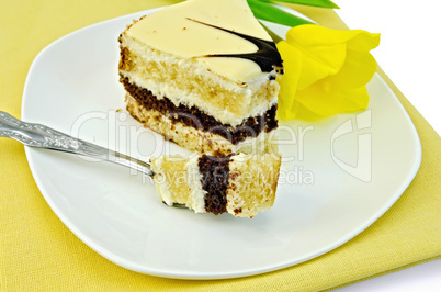 Cake with yellow tulip on a napkin