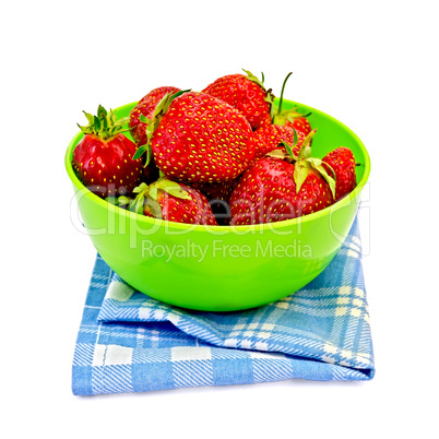 Strawberries in a green bowl with a napkin