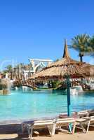 Sunbeds near swimming pool at luxury hotel, Sharm el Sheikh, Egy