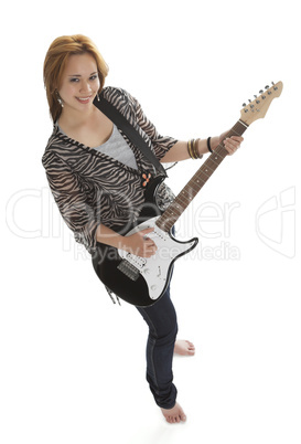 young rock lady with an electric guitar view from above