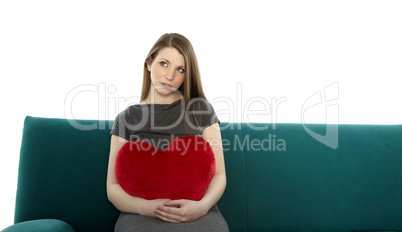 beautyful young woman with heart pillow