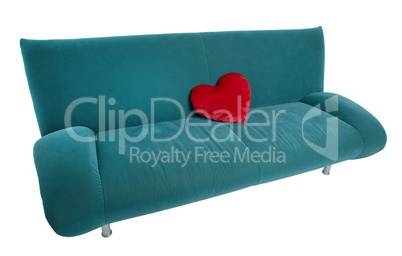 green sofa with red heart shaped pillow