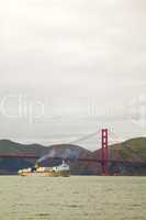 Ocean vessel under Golden Gates bridge in San Francisco