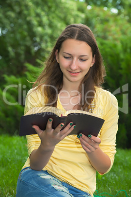 Teen girl reading book