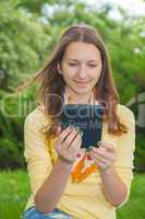 Teen girl reading electronic book
