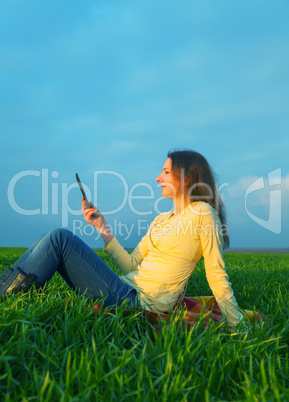 teen girl reading electronic book