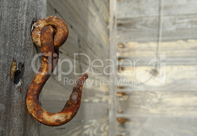 Peeling paint on rusted metal surface.