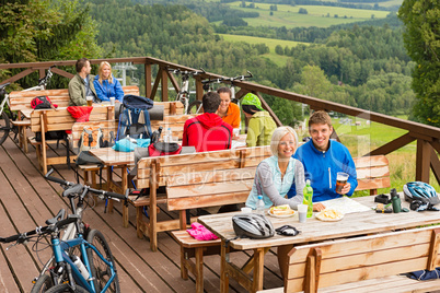 Young people relax looking at mountain landscape