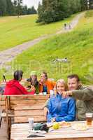 Young tourists in nature sitting bench