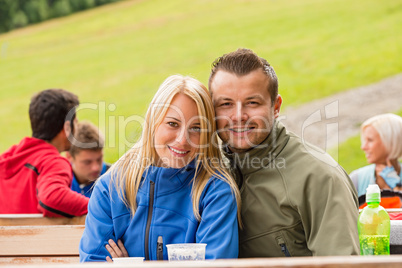 Smiling young couple outdoors resting weekend