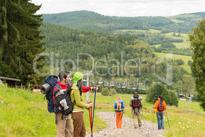 Young hikers enjoying scenic view on mountain