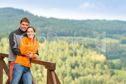 Loving couple on romantic summertime weekend hill