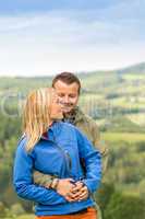 Lovely young couple hugging with scenic view