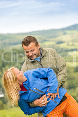 Smiling young couple posing outdoors