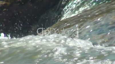 Water flowing over boulders