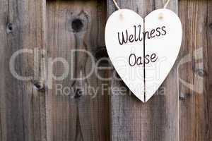 Wooden fence and wellness signboard